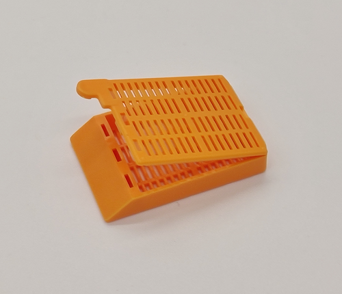 plastic biopsy tissue cassettes with attached lid and 35 angled face orange 